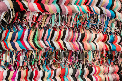 bras hanging on the wall at the central market